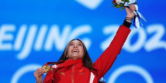 Gold medalist Eileen Gu of Team China celebrates with her medal during the Women's Freestyle Skiing Freeski Big Air medal ceremony on Day 4 of the Beijing 2022 Winter Olympic Games at Beijing Medal Plaza on Feb. 8, 2022, in Beijing, China.