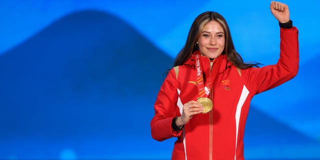 Gold medalist Eileen Gu of Team China poses with her medal during the Women's Freestyle Skiing Freeski Big Air medal ceremony on Day 4 of the Beijing 2022 Winter Olympic Games at Beijing Medal Plaza on Feb. 8, 2022, in Beijing, China.