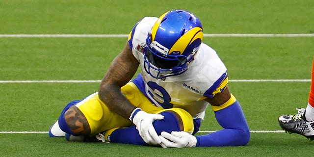 Odell Beckham Jr. of the Los Angeles Rams holds his knee after an injury during Super Bowl LVI at SoFi Stadium on Feb. 13, 2022, in Inglewood, California.