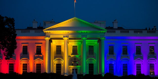 The White House stands illuminated in rainbow-colored light at dusk in Washington, D.C., U.S., on Friday, June 26, 2015.