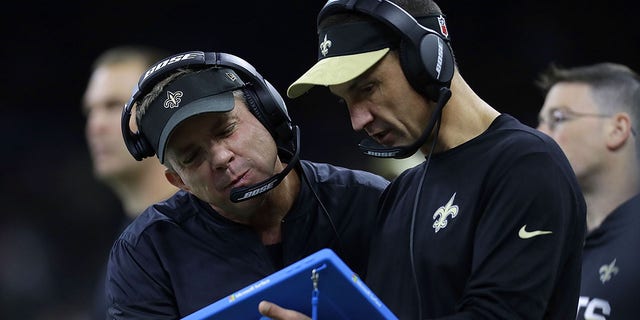 Head coach Sean Payton of the New Orleans Saints and defensive coordinator Dennis Allen use a Microsoft Surface during a game against the Seattle Seahawks at the Mercedes-Benz Superdome on Oct. 30, 2016 in New Orleans, Luisiana.