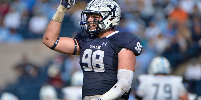 Yale Bulldogs defensive end Kyle Mullen (98) gestures to the crowd during a game against the Columbia Lions Oct. 28, 2017, at Yale Bowl in New Haven, Conn. 