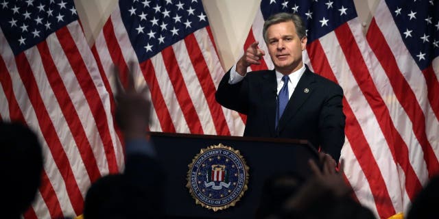 Director Christopher A. Wray speaks to the media during a news conference at FBI headquarters, on June 14, 2018, in Washington.