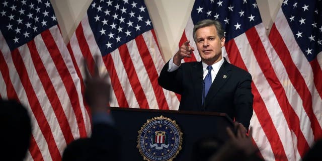 FBI Director Christopher Wray speaks during a news conference at FBI headquarters on June 14, 2018, in Washington, D.C.
