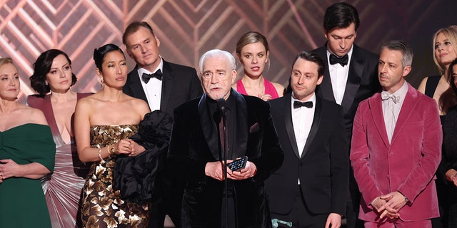 (L-R) J. Smith-Cameron, Dagmara Dominczyk, Jihae, Scott Nicholson, Dasha Nekrasova, Brian Cox, Kieran Culkin, Nicholas Braun, Jeremy Strong and Justine Lupe accept the award for outstanding performance by an ensemble in a drama Series for 'Succession' onstage during the 28th Annual Screen Actors Guild Awards at Barker Hangar on February 27, 2022, in Santa Monica, California. 