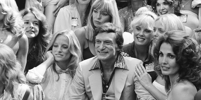 Playboy Playmates (L-R) Claudia Jennings, Monique St. Pierre, Playboy founder Hugh Hefner, Playmates Dorothy Stratten, Connie Kreski and Angela Dorian. The group was celebrating Playboy Magazine's 25th Anniversary All-Day Saturday Playmate Reunion at the Playboy Mansion West on September 8, 1979, in Los Angeles.