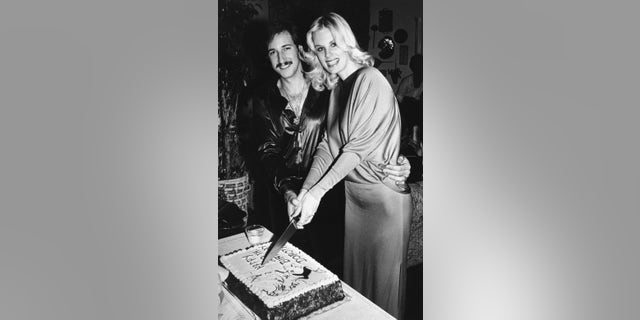 Dorothy Stratten celebrating her 20th birthday with her husband, Paul Snider, at their West Los Angeles home. Stratten was shot to death in the same house by her estranged husband, who then committed suicide. The couple had been separated for several months.