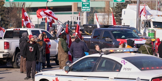 Protesters against COVID-19 vaccine mandates block the roadway at the Ambassador Bridge border crossing in Windsor, Ontario, Canada, on Feb. 9, 2022. 