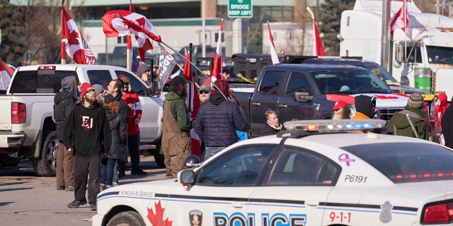 Protesters against COVID-19 vaccine mandates block the roadway at the Ambassador Bridge border crossing in Windsor, Ontario, Canada, on Feb. 9, 2022.