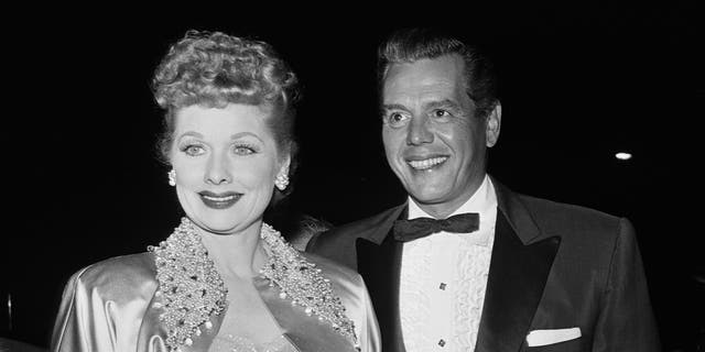 American actress Lucille Ball (1911 - 1989) and her husband, actor and musician, Desi Arnaz (1917 - 1986) attending a formal event, USA, circa 1955.
