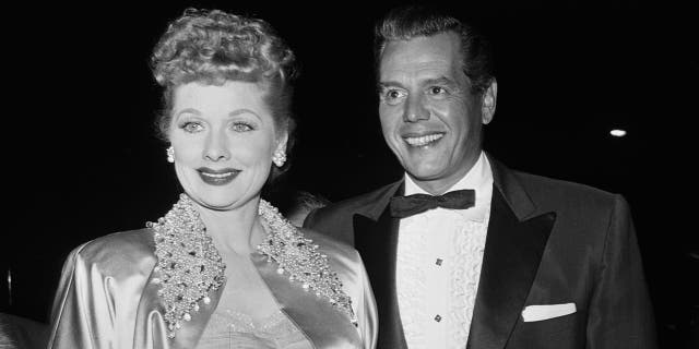 American actress Lucille Ball (1911 - 1989) and her husband, actor and musician, Desi Arnaz (1917 - 1986) attending a formal event, USA, circa 1955.