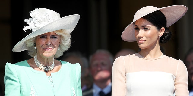  (L-R) Camilla, Duchess of Cornwall and Meghan, Duchess of Sussex attend The Prince of Wales' 70th Birthday Patronage Celebration held at Buckingham Palace on May 22, 2018 in London, England. 