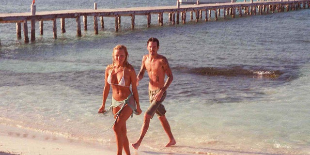 Pamela Anderson and Tommy Lee on the beach following their wedding in Cancun, Mexico, February 1995.