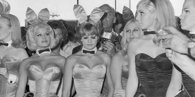 A group of Playboy Bunny Girls from London's Playboy Club waiting for Hugh Hefner, the American owner of the 'Playboy' business empire at London Airport. 