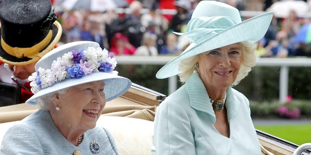 Queen Elizabeth II and Camilla, Duchess of Cornwall arrive in a horse carriage on day two of Royal Ascot at Ascot Racecourse on June 19, 2019, in Ascot, England.