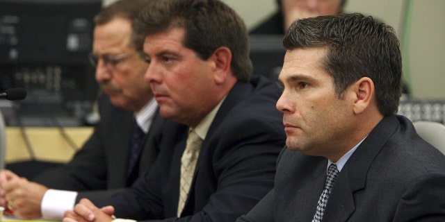 The Station nightclub owners Michael (center) and Jeffrey Derderian (right) listen to victim impact statements with attorney Richard Egbert Sept. 29, 2006, during their sentencing trial at the Kent County Courthouse in Warwick, Rhode Island.