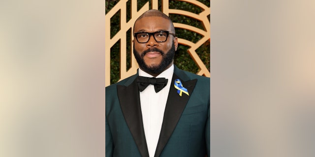 Like many performers, Tyler Perry wore a blue and yellow ribbon.