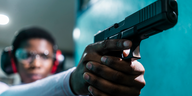 Woman at shooting range