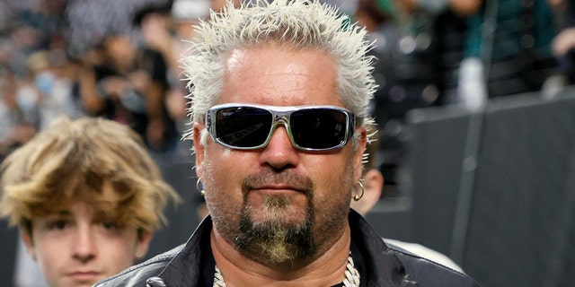 Chef and television personality Guy Fieri and his son Ryder Fieri attend the Eagles-Raiders game at Allegiant Stadium on Oct. 24, 2021, in Las Vegas.