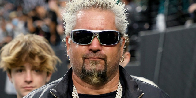 Chef and television personality Guy Fieri and his son Ryder Fieri attend the Eagles-Raiders game at Allegiant Stadium on Oct. 24, 2021, in Las Vegas.