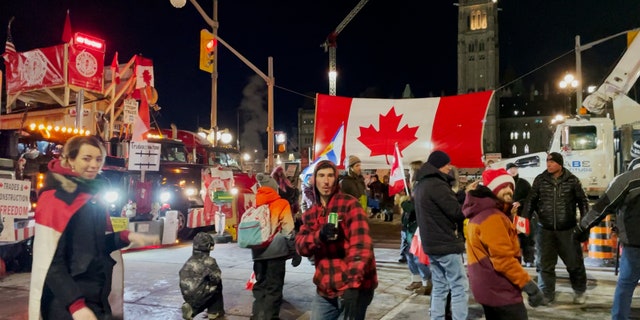 Protesters dance outside of the Canadian Parliament on the 19th day of the Freedom Convoy