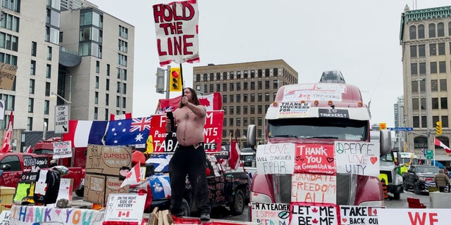 Freedom Convoy demonstrator "hold the line" Autograph while dancing in Ottawa, Canada.