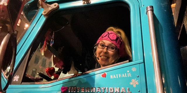 Canadian trucker Natalie parked in her blue truck