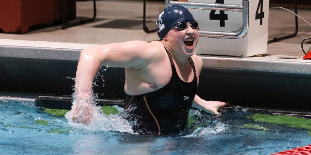 Iszac Henig reacts after winning the finals of the 50-yard freestyle during the Women’s Ivy League Swimming and Diving Championships at Harvard University Feb 17, 2022.