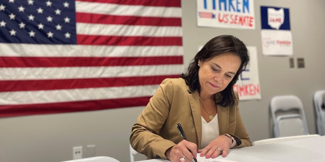 Ohio Senate candidate and former state GOP chair Jane Timken signs a 'Stop Critical Race Theory' pledge, at her campaign office in Columbus, Ohio on July 12, 2021.