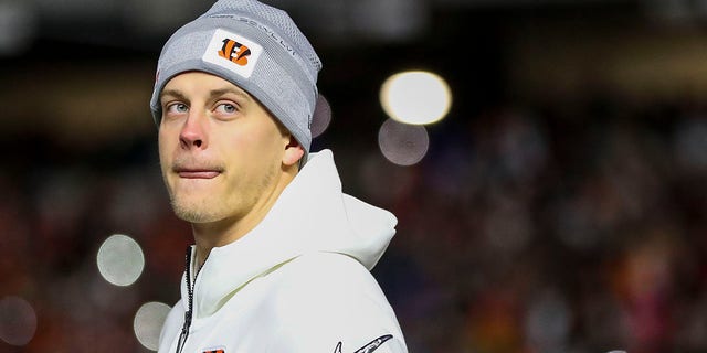 Cincinnati Bengals quarterback Joe Burrow walks onto the field during the Super Bowl Opening Night Fan Rally at Paul Brown Stadium.