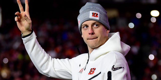 Joe Burrow, #9 of the Cincinnati Bengals, walks onto the field as he is introduced during a Cincinnati Bengals Fan Rally ahead of Super Bowl LVI at Paul Brown Stadium on February 07, 2022 in Cincinnati, Ohio.