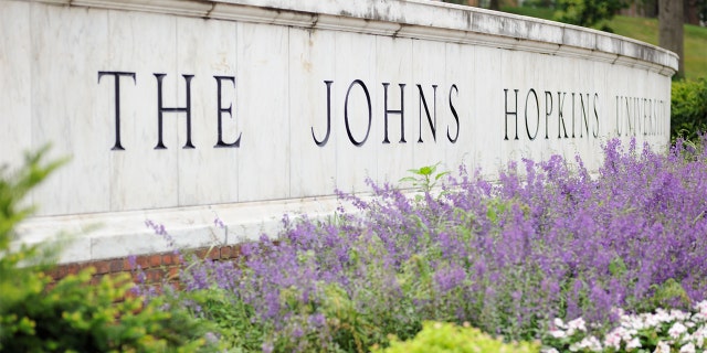 Baltimore, Maryland, USA - July 25, 2016: Close up of sign for The Johns Hopkins University in Baltimore, Maryland.  Sign located on North Charles Street along the east gate to campus.