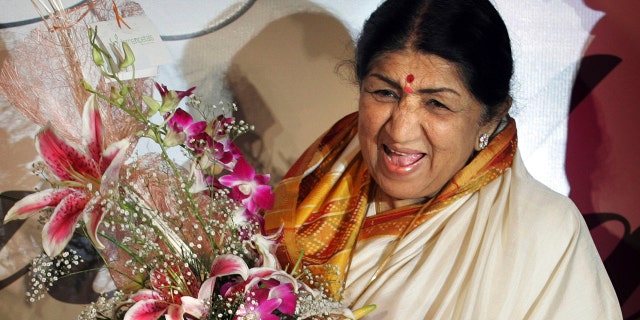 Singer Lata Mangeshkar laughs at the launch of her hindi music album 'Saadgi' or Simplicity, on World Music Day, in Mumbai, India, Thursday, June 21, 2007.  Lata Mangeshkar, legendary Indian singer with a voice recognized by a billion people in South Asia, has died at 92.