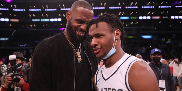 Lebron James comes onto the court to congratulate his son Bronny James after his team Sierra Canyon won against St. Vincent-St. Mary during The Chosen-1's Invitational High School Basketball Showcase at Staples Center in Los Angeles on Dec. 4, 2021.