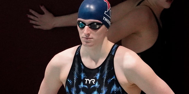 Penn's Lia Thomas waits to compete in a qualifying heat of the 500 yard freestyle event at the Ivy League Women's Swimming and Diving Championships at Harvard University, Thursday, Feb. 17, 2022, in Cambridge, Mass.