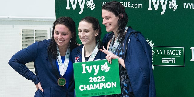 University of Pennsylvania swimmer Lia Thomas, right smiling on the podium after winning the 500 freestyle during the 2022 Ivy League Womens Swimming and Diving Championships at Blodgett Pool on February 17, 2022, in Cambridge, Massachusetts.