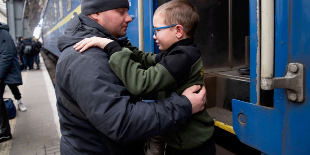 Father and son are forced to part at a train station in Lviv, Ukraine, as Putin's Russian forces threaten the country. Ruslan Gladkiy shared how difficult it was to say goodbye to his nine-year-old son and send him off to Hungary. 