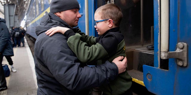 Father and son are forced to part at a train station in Lviv, Ukraine, as Putin's Russian forces threaten the country. Ruslan Gladkiy shared how difficult it was to say goodbye to his nine-year-old son and send him off to Hungary. 