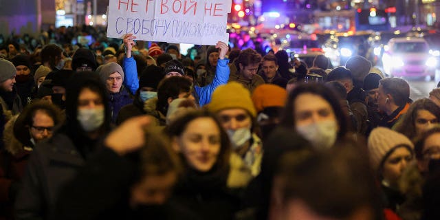 A person carries a banner during an anti-war protest, after Russia launched a massive military operation against Ukraine, in Moscow, Russia February 24, 2022. The banner reads "No war. Freedom for political prisoners".