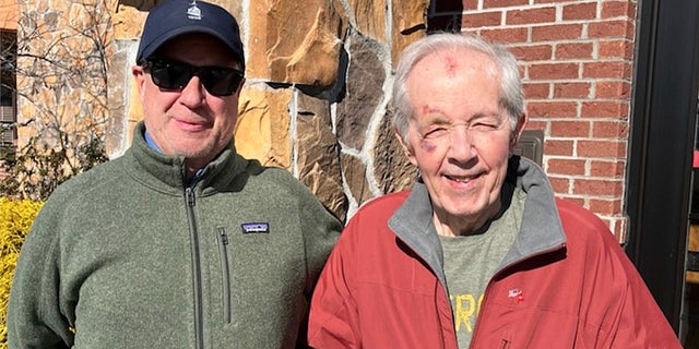 Veteran Ed Norton (at right, in red jacket) with a good friend and neighbor, John Vino, who takes him to church and helps him with errands.