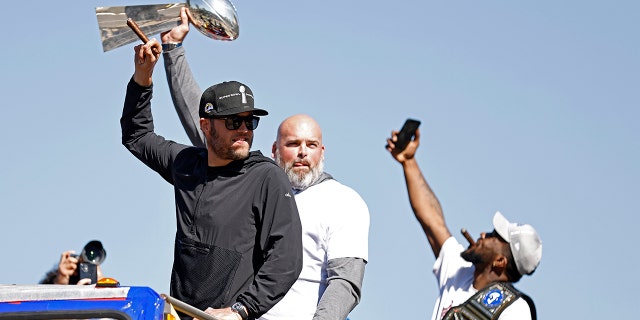 Matthew Stafford (left) and Andrew Whitworth (center) of the Los Angeles Rams celebrate during the Super Bowl LVI Victory Parade on Feb. 16, 2022, in Los Angeles, California.