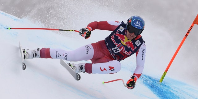 Austria's Matthias Mayer speeds down the course during an alpine ski, men's World Cup downhill, in Kitzbuehel, Austria, Sunday, Jan. 23, 2022.