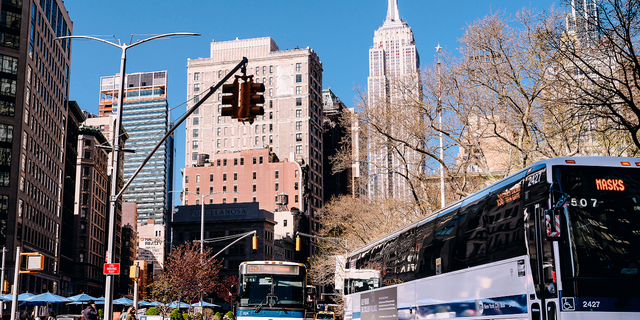 MTA buses drive down Broadway in New York City, on April 13, 2021. 