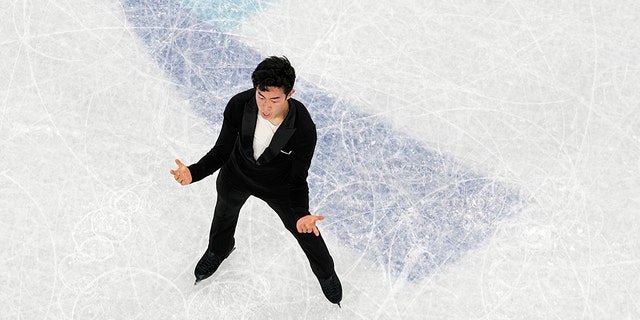 Nathan Chen, of the United States, competes during the men's singles short program team event in the figure skating competition at the 2022 Winter Olympics, Friday, Feb. 4, 2022, in Beijing.