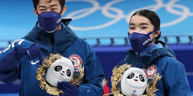 Silver medalists Karen Chen and Nathan Chen pose for a photo after the team event in the figure skating competition at the 2022 Winter Olympics, Monday, Feb.  7, 2022, in Beijing.