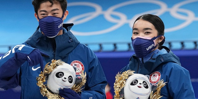 Silver medalists Karen Chen and Nathan Chen pose for a photo after the team event in the figure skating competition at the 2022 Winter Olympics, Monday, Feb. 7, 2022, in Beijing.