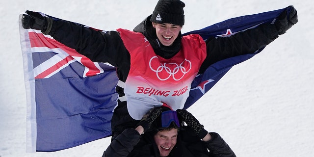 Gold medal winner New Zealand's Nico Porteous celebrates during the venue award ceremony for the men's halfpipe finals at the 2022 Winter Olympics, Saturday, Feb. 19, 2022, in Zhangjiakou, China.