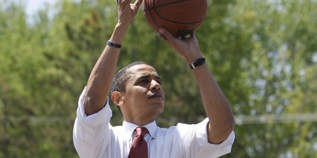 US Democratic presidential candidate Illinois Senator Barack Obama plays basketball at Riverview High School in Elkhart, Indiana, on May 04, 2008.