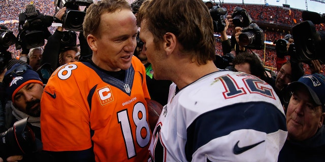 Quarterbacks Peyton Manning of the Denver Broncos and Tom Brady of the New England Patriots shake hands following the AFC Championship game at Sports Authority Field at Mile High on Jan. 24, 2016 in Denver, Colorado. The Broncos defeated the Patriots 20-18.