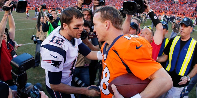 Tom Brady of the New England Patriots congratulates Peyton Manning of the Denver Broncos after the Broncos defeated the Patriots 26 to 16 during the AFC Championship game at Sports Authority Field at Mile High on Jan. 19, 2014 in Denver, Colorado.